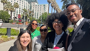Public Advocates staff smiling with higher education students